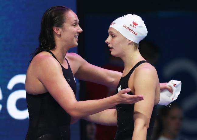 CAN Relay Bronze 1 Chantal Van Landeghem hugs Penny Oleksiak on winning bronze in the mixed 4x100m freestyle relay at the 2017 FINA World Championships Photo: Swimming Canada/Ian MacNicol