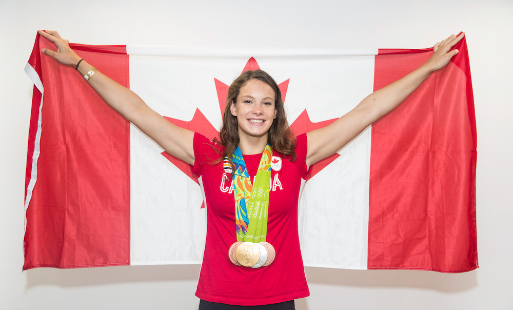 Penny Oleksiak poses with her four medals from Rio 2016.