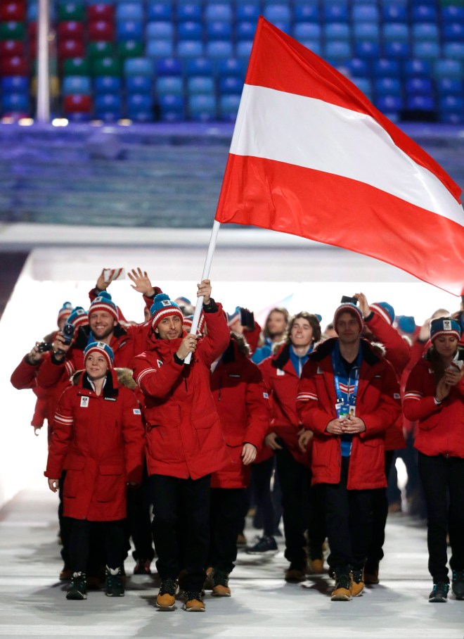 Mario Strecher of Austria carries the national flag as he leads the team during the opening ceremony of the 2014 Olympic Winter Games in Sochi, Russia, Friday, Feb. 7, 2014. (AP Photo/Mark Humphrey)