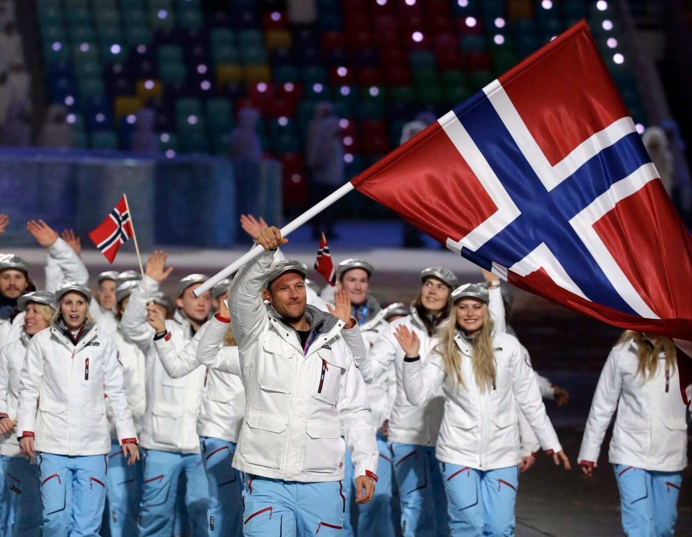 Aksel Lund Svindal of Norway carries the national flag as he leads the team during the opening ceremony of the 2014 Olympic Winter Games in Sochi, Russia, Friday, Feb. 7, 2014. (AP Photo/Mark Humphrey)