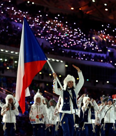 Sarka Strachova of the Czech Republic carries the national flag during the opening ceremony of the 2014 Olympic Winter Games in Sochi, Russia, Friday, Feb. 7, 2014. (AP Photo/Matt Dunham)