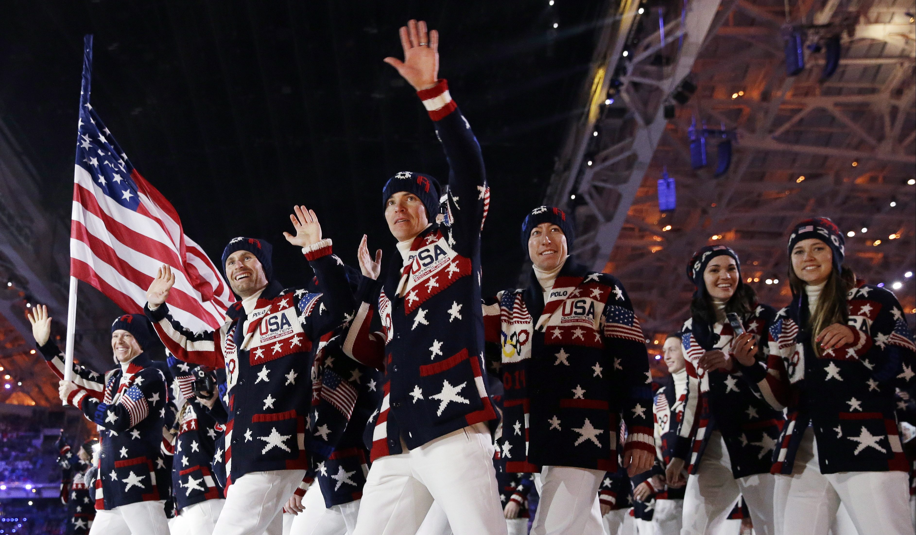 This Feb. 7, 2014 file photo shows the United States team arrives during the opening ceremony of the 2014 Olympic Winter Games in Sochi, Russia. Ralph Lauren's love for the American flag and American style earned him high honors Tuesday, June 17, from the Smithsonian Institution, celebrating his five decades in fashion. Lauren designed the uniforms for the US Winter Olympic team. (AP Photo/Patrick Semansky, File)