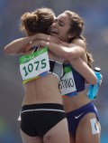 New Zealand's Nikki Hamblin, left, and United States' Abbey D'Agostino after competing in a women's 5000-meter heat during the athletics competitions of the 2016 Summer Olympics at the Olympic stadium in Rio de Janeiro, Brazil, Tuesday, Aug. 16, 2016. (AP Photo/David J. Phillip)