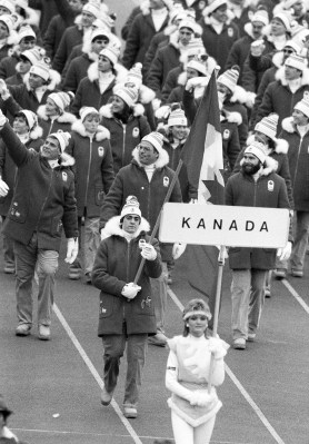 Speedskater Gaetan Boucher from Quebec City carries the flag as he leads the Canadian team in the opening ceremony of the XIV Olympic Winter Games in Sarajevo, February 8th, 1984. (CP PHOTO/Nick Didlick)