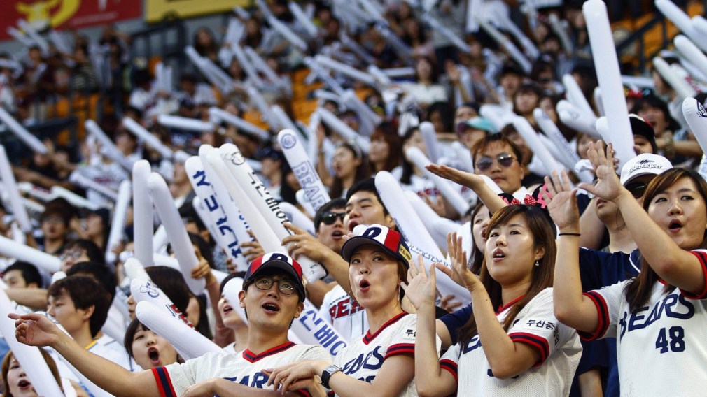 Team Canada - fans of the South Korean baseball team Doosan Bears sing songs while performing dance routines at Jamsil Stadium in Seoul, South Korea.