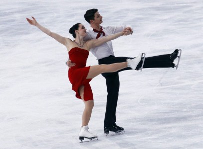 Tessa Virtue, left, and Scott Moir of Canada perform their Ice Dance Free Dance during the Ice Skating Bompard Trophy at Bercy arena in Paris, Saturday, Nov. 19, 2011. (AP Photo/Francois Mori)