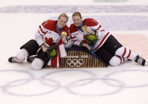Haley Irwin and teammate Cherie Piper pose with their gold medals