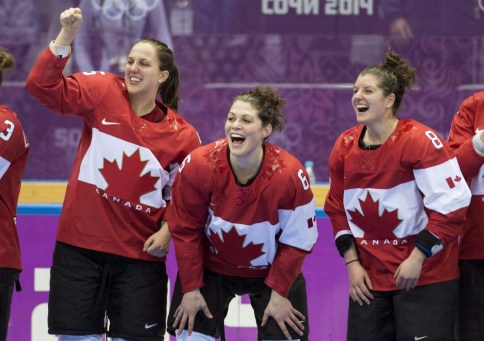 Lauriane Rougeau, Rebecca Johnston, and Laura Fortino, left to right, celebrate