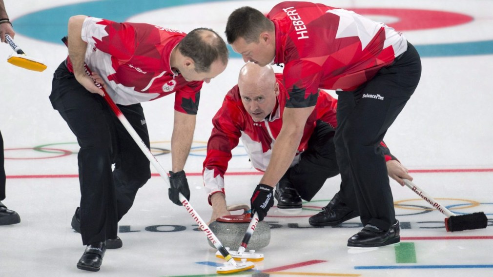 Canada skip Kevin Koe follows his front end of second Brent Laing