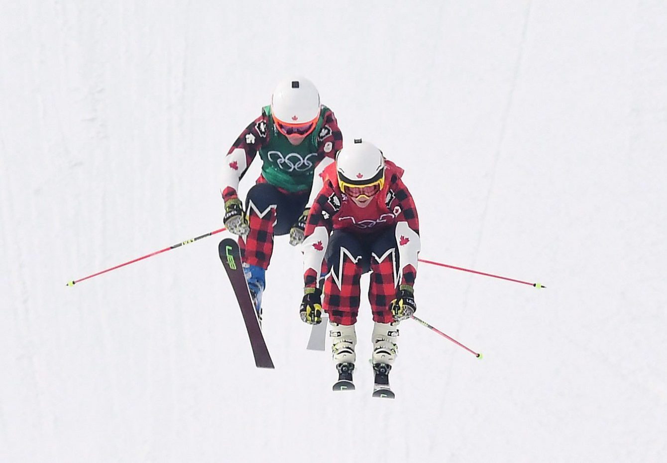 Gold medalist Kelsey Serwa, front, and silver medalist Brittany Phelan both of Canada compete in the women's ski cross final at the Phoenix Snow Park at the 2018 Winter Olympic Games in Pyeongchang, South Korea, Friday, Feb. 23, 2018. THE CANADIAN PRESS/Jonathan Hayward