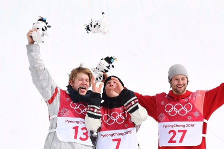 Gold medallist Sebastien Toutant of Canada, centre, silver medallist Kyle Mack of the United States, left, and bronze medallist Billy Morgan of Great Britain celebrate following the men's snowboard big air final at the 2018 Winter Olympic Games in Pyeongchang, South Korea, Saturday, Feb. 24, 2018. THE CANADIAN PRESS/Jonathan Hayward