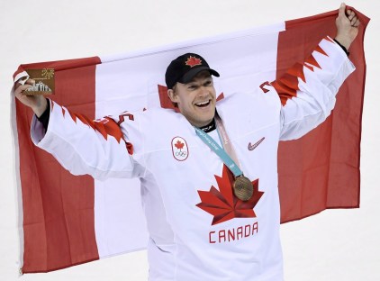 Canada goaltender Justin Peters (35) holds the flag up as the team celebrates their win following third period men's hockey bronze medal game action against Czech Republic at the 2018 Olympic Winter Games, in Pyeongchang, South Korea, on Saturday, February 24, 2018. THE CANADIAN PRESS/Nathan Denette