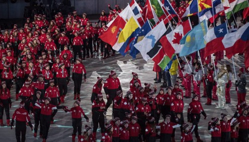 Canadian short-track speed skater Kim Boutin leads team Canada into the Olympic stadium Canadian athletes walk into the Olympic stadium during the closing ceremonies at the 2018 Pyeongchang Olympic Winter Games in Pyeongchang, South Korea, on Sunday, February 25, 2018. THE CANADIAN PRESS/Nathan Denettethe Canadian flag during the closing ceremonies at the 2018 Pyeongchang Olympic Winter Games in Pyeongchang, South Korea, on Sunday, February 25, 2018. THE CANADIAN PRESS/Nathan Denette