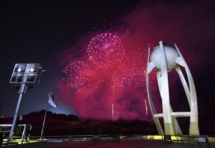 Fireworks explode near the Olympic cauldron after the flame was extinguished at the conclusion of the closing ceremony of the 2018 Winter Olympics in Pyeongchang, South Korea, Sunday, Feb. 25, 2018. (Florien Choblet/Pool Photo via AP)