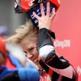 Alex taking off her helmet