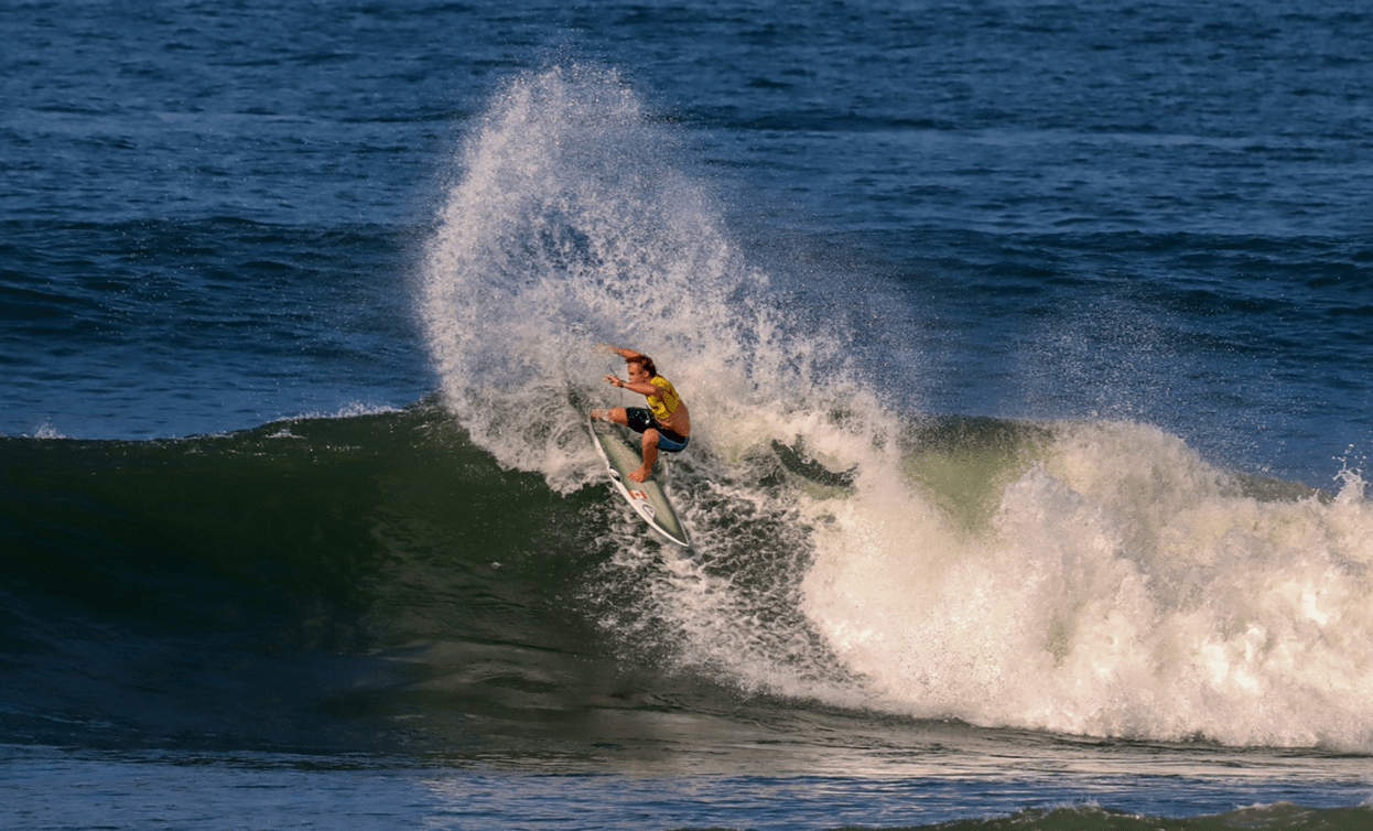 Cody Young surfs a large wave