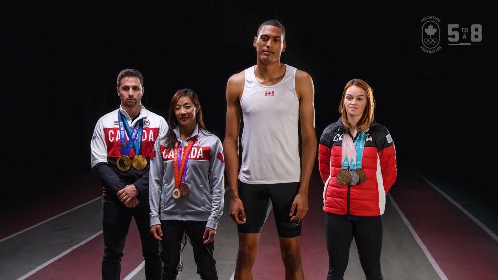 Olympians posing with their medals