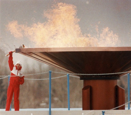 The Olympic flame burns bright over Calgary's McMahon Stadium Saturday, Feb. 13, 1988, after 12-year-old Robyn Perry, a novice figure skater from Calgary, held the torch aloft to light the massive cauldron and light the flame which will burn for16 days. THE CANADIAN PRESS/Philip Walker