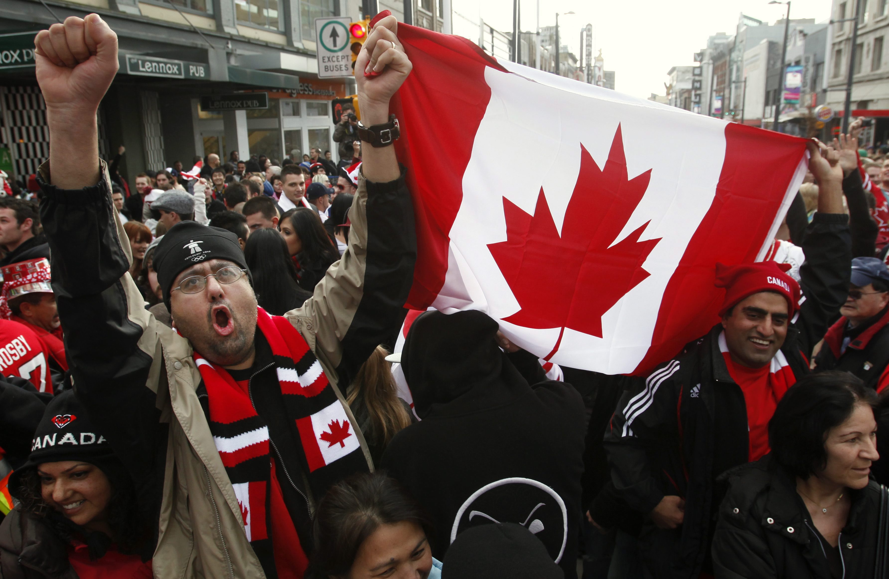 Canadian fans celebrate their gold medal victory against the United States in the final hockey match at the Vancouver 2010 Olympics, in downtown Vancouver, British Columbia, Sunday, Feb. 28, 2010. (AP Photo/Chris Carlson)