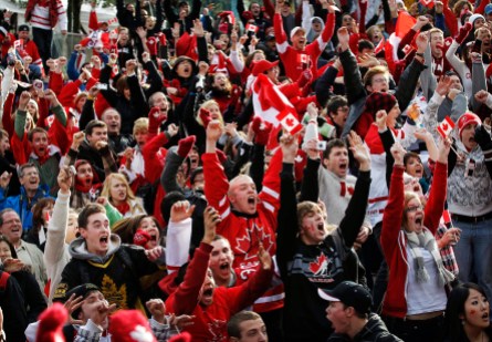 Team Canada fans Vancouver 2010 Canadian fans celebrate as Team Canada score in overtime in their gold medal victory against the United States in the final hockey match at the Vancouver 2010 Olympics, while watching the game on a giant display in downtown Vancouver, British Columbia, Sunday, Feb. 28, 2010. (AP Photo/Kevin Frayer)