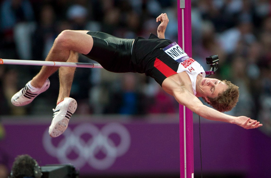 Derek Drouin clears the high jump bar 
