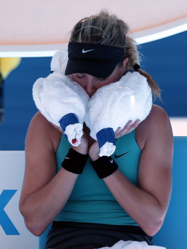 team-canada-eugenie-bouchard-australian-open-2014 Eugenie Bouchard using ice in a towel to cool off at the 2014 Australian Open. (AP Photo/Aijaz Rahi)