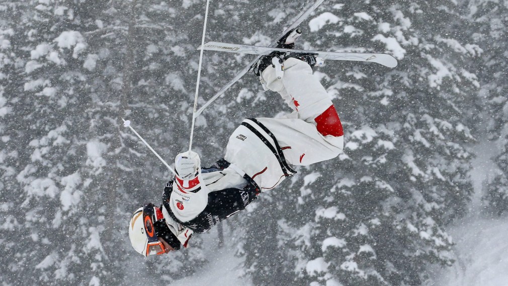 Mikael Kingsbury performs a jump in moguls