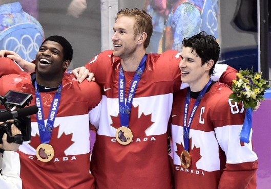 Team Canada players celebrate gold medal