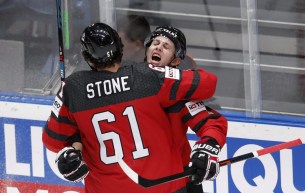 Mark Stone and Troy Stecher hugging after goal