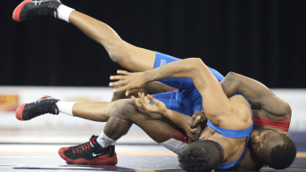 Wrestlers grappling on the floor