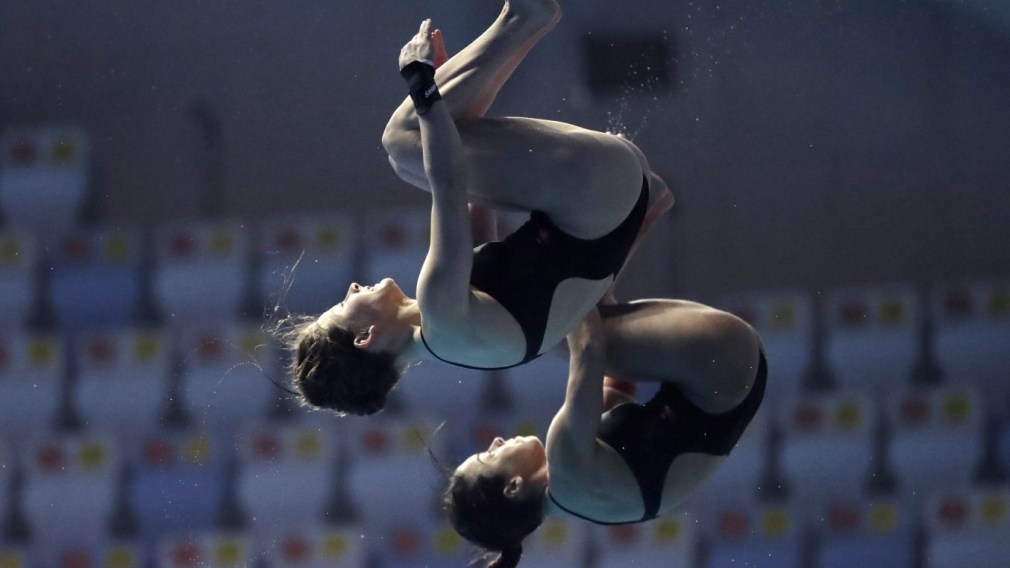 Canada's Meaghan Benefeito and Caeli McKay compete in the 10m platform women's synchro diving