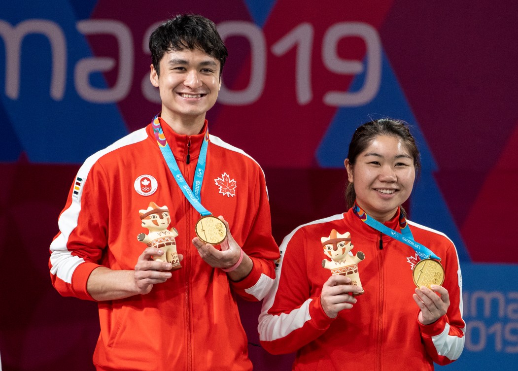 Joshua Hurlburt-Yu and Josephine Wu celebrate Mixed Badminton Gold at the 2019 Pan Am Games in Lima, Peru