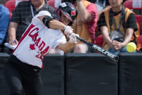 Canada's Jennifer Gilbert swings during fourth inning playoff action against Mexico at the Softball Americas Olympic Qualifier tournament
