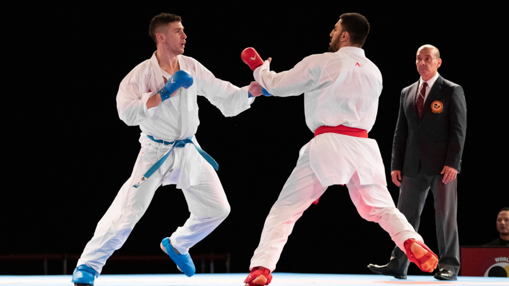 Two karate athletes fighting