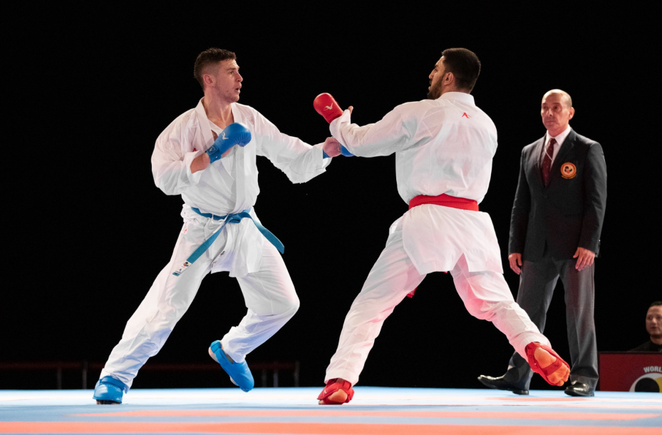Two karate athletes fighting