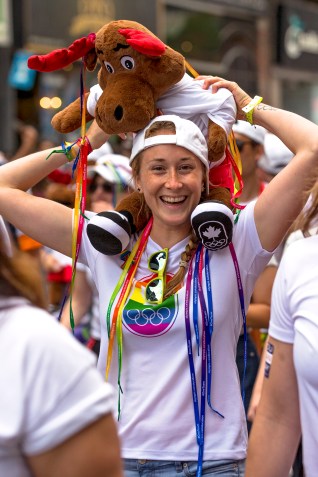 Rosie Cossar poses for photo with stuffed animal on her shoulders