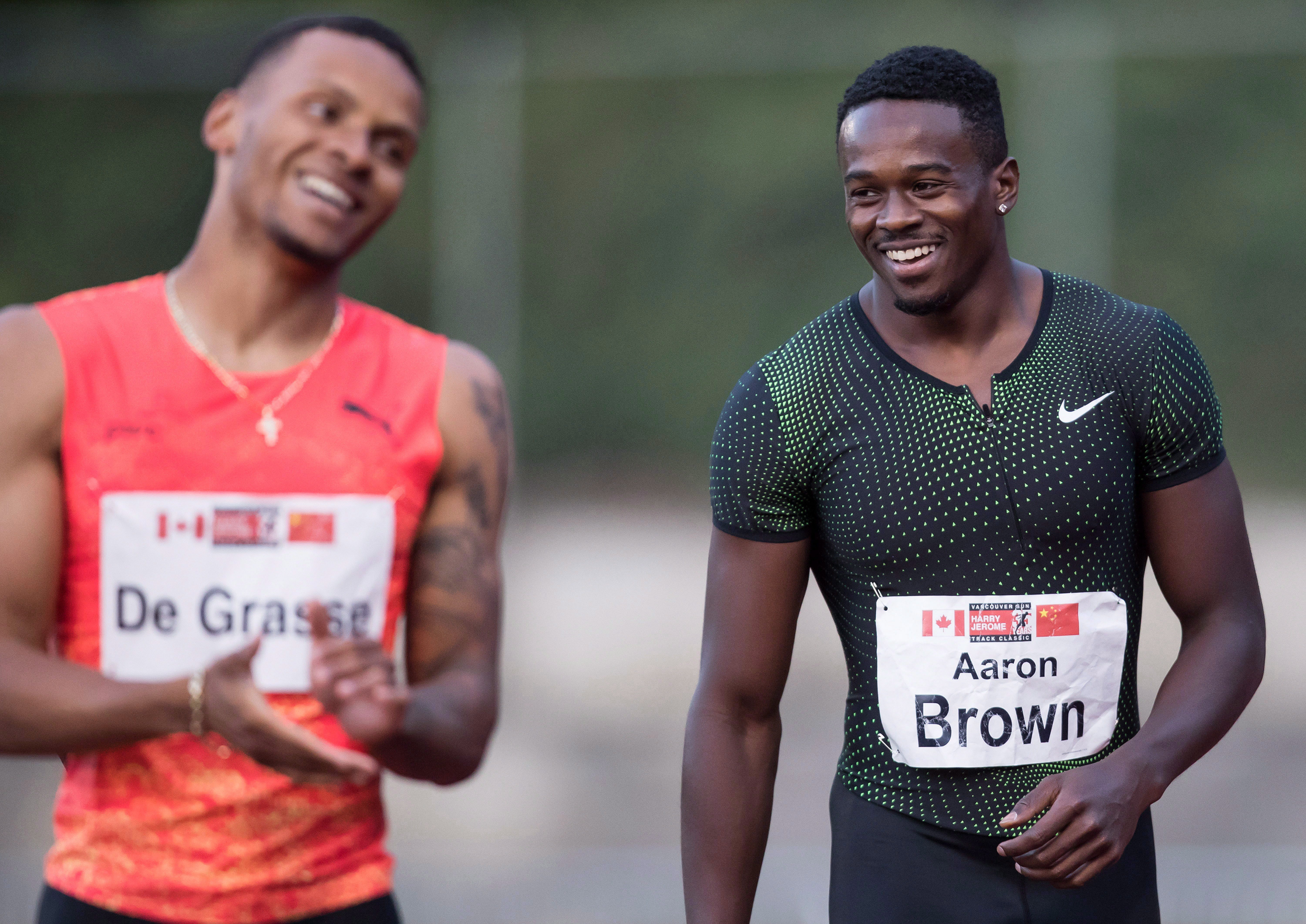 Aaron Brown and Andre De Grasse laugh together