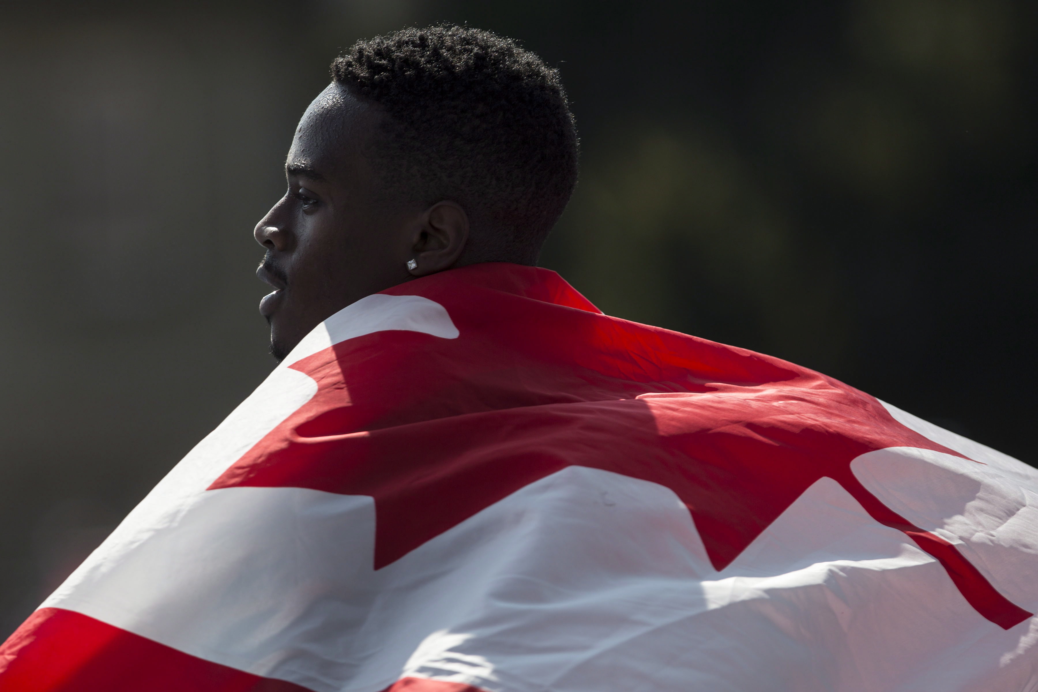 Aaron Brown with Canadian flag on his back