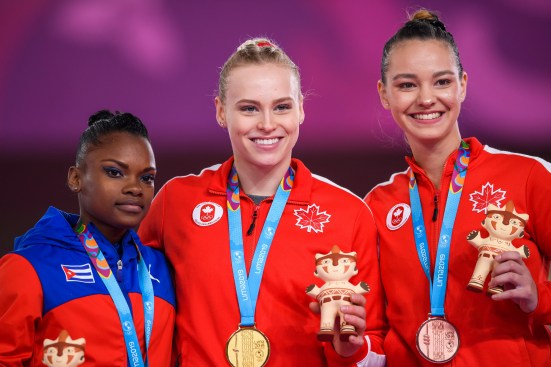 VEP_20190730_23 Three women pose with their gold, silver and bronze medals