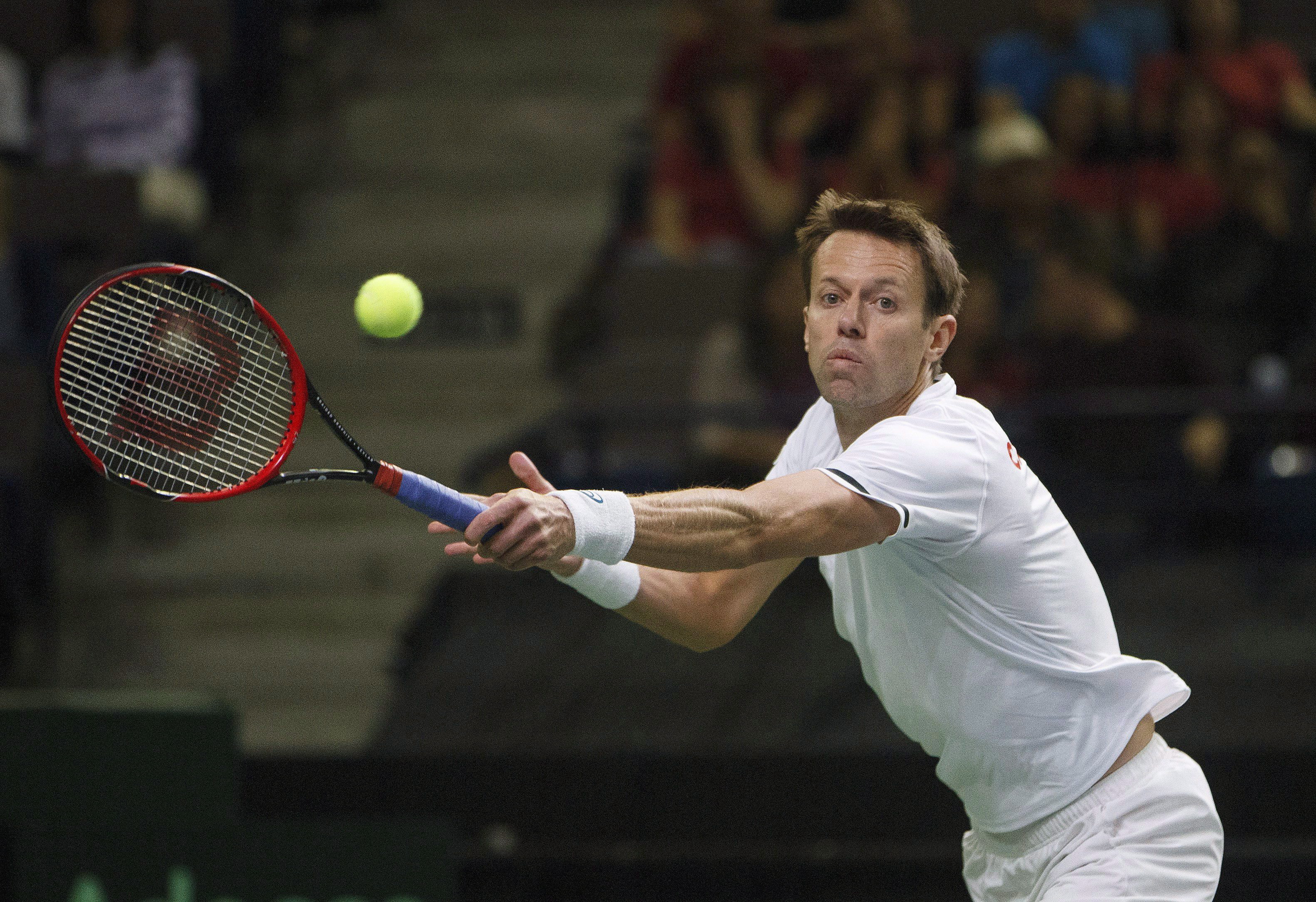 Daniel Nestor about to hit the ball