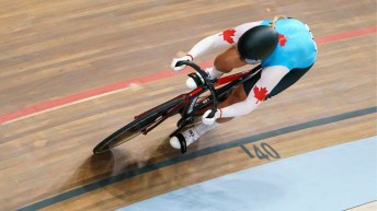 Cyclist on velodrome track