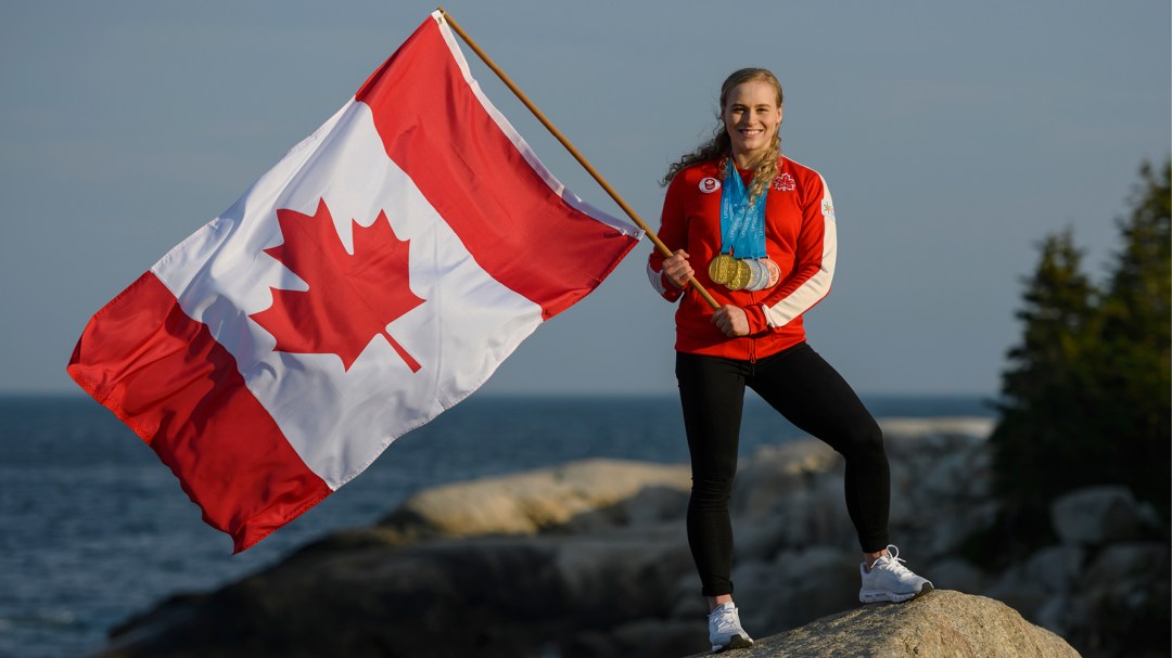 Canadian athlete with flag