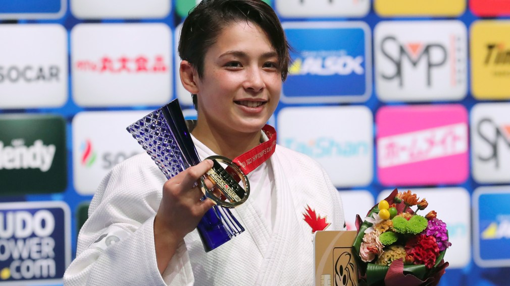 Christa Deguchi poses for a photo with her gold medal from the women's -57 kg weight class at the Judo World Championships