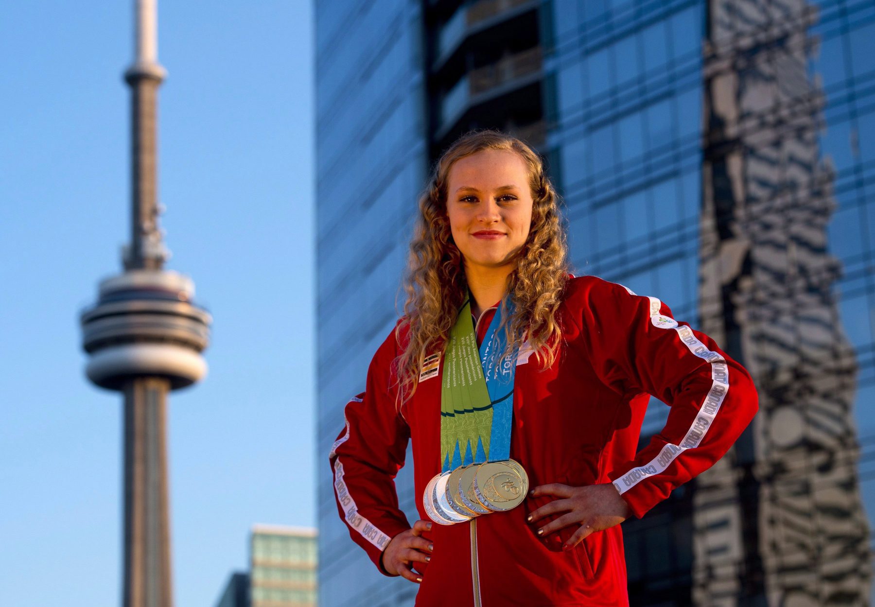 Ellie Black on a Toronto rooftop with her five Pan Am Games medals in 2015