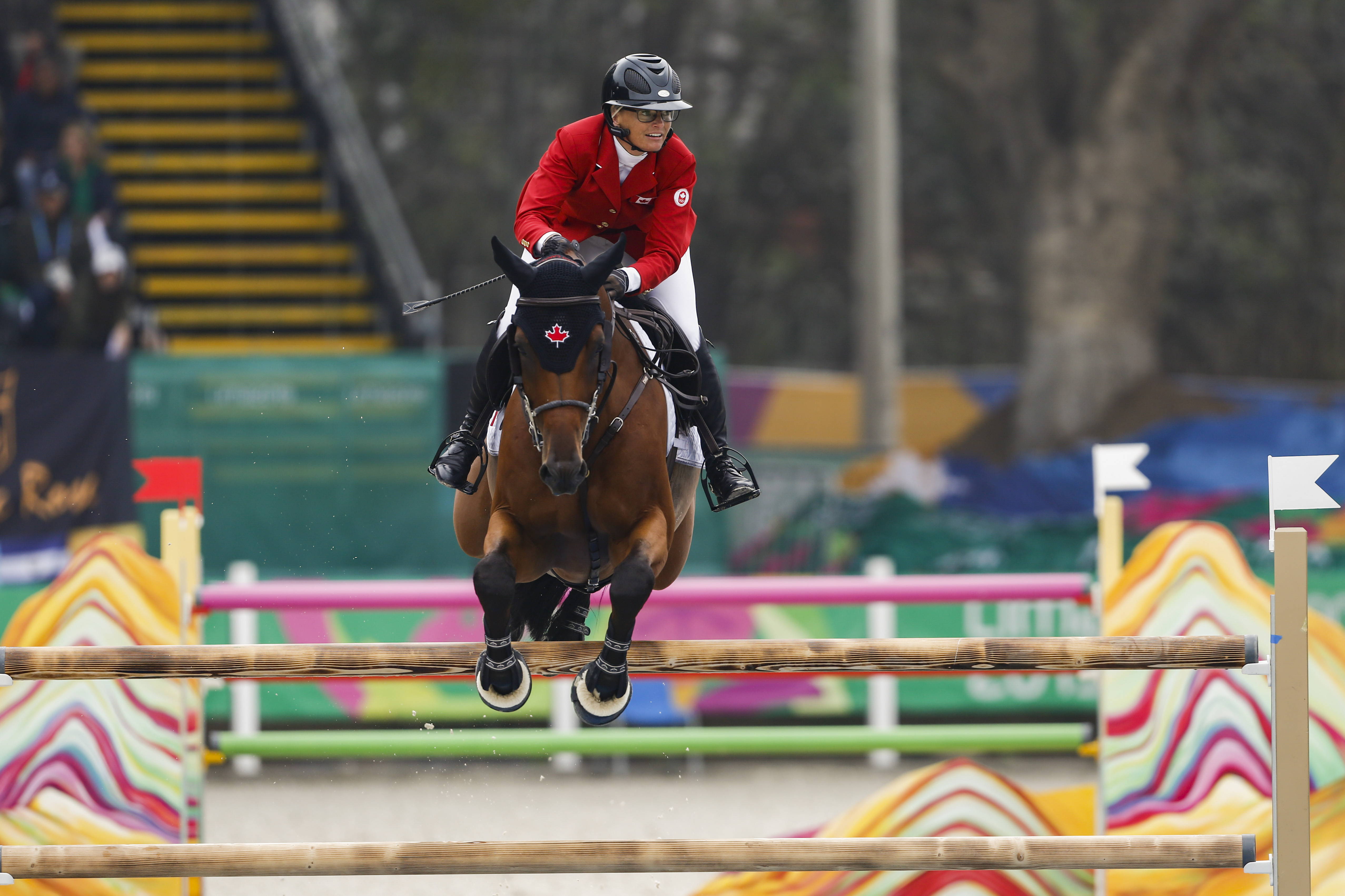 horse and rider jump over a jump