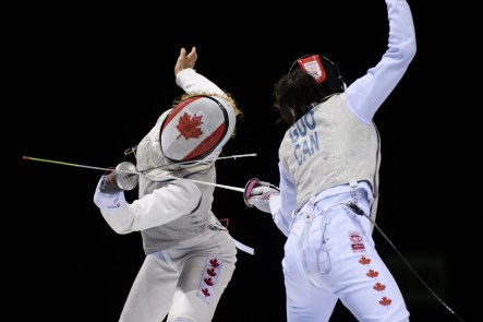 two fencers compete