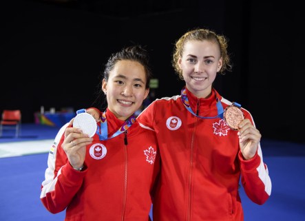 Jessica (left) and Eleanor hold up their gold and bronze medals
