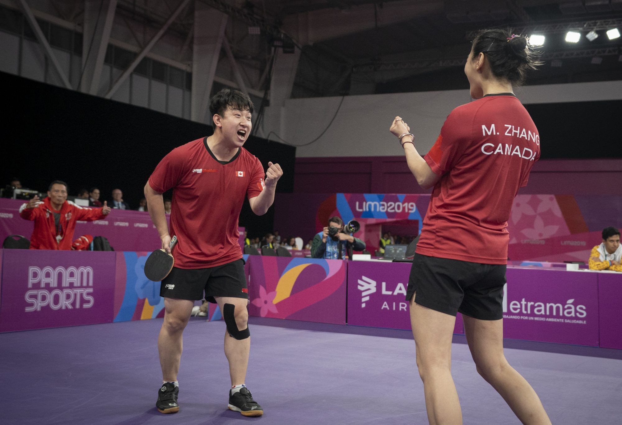 two athletes celebrate a win