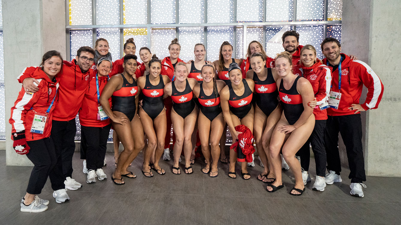 Women's water polo poses after qualifying for Tokyo 2020