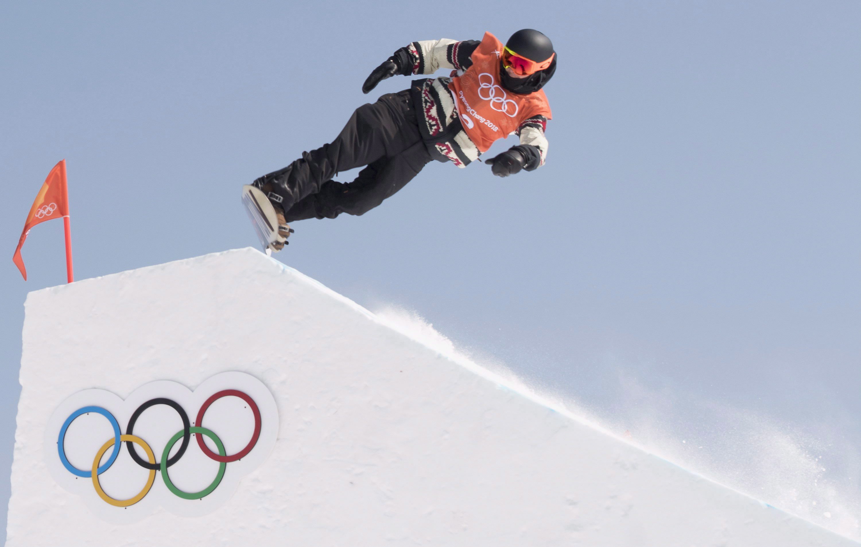 Mark McMorris about to snowboard down a hill at the Pyeong Chang Olympics. 